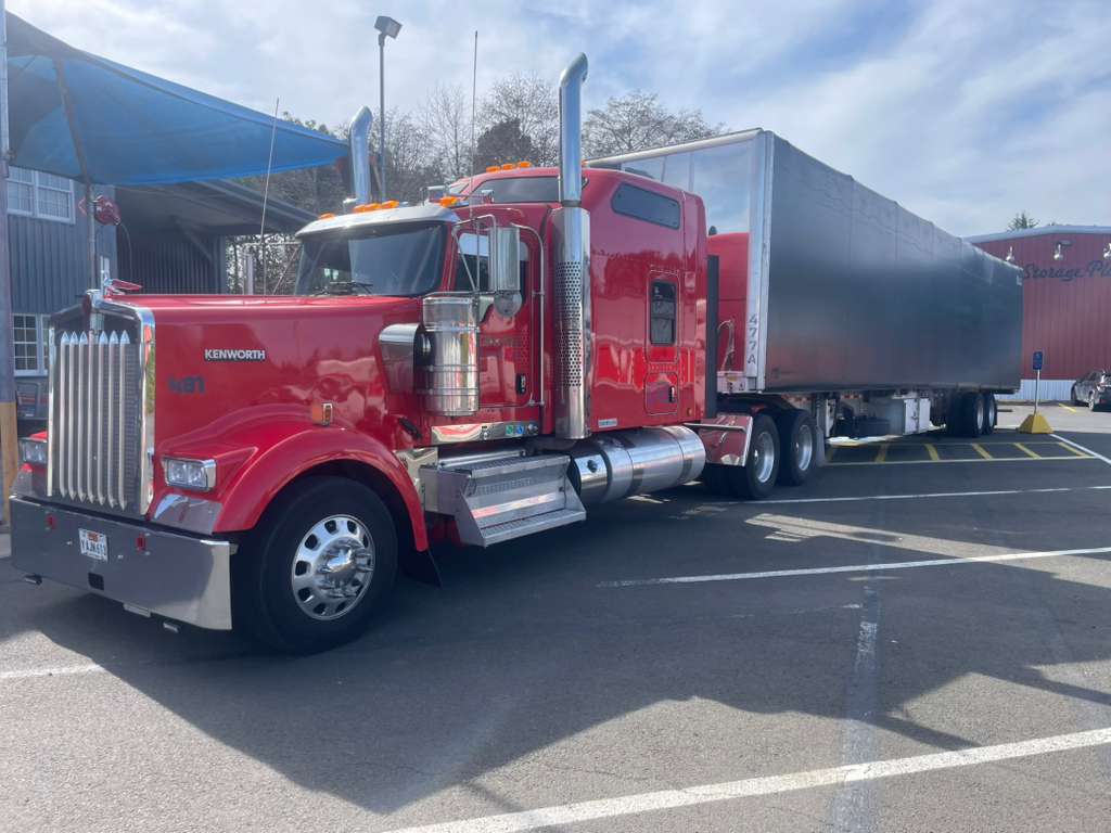 Koval Trucking red truck with Conestoga trailer ready for freight